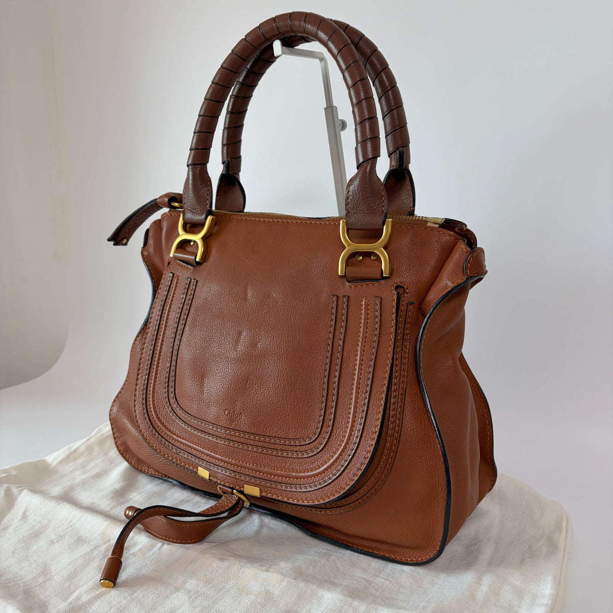 Authentic Chloé Marcie Shoulder Bag brown leather side view with signature stitching and gold-tone hardware