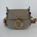Authentic Chloé Tess Small Crossbody Bag gray leather front view with gold-tone ring closure