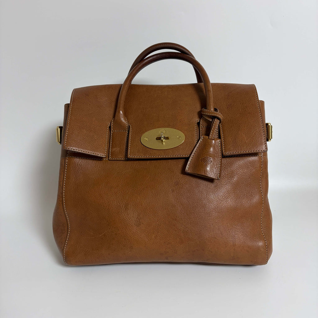 Authentic Mulberry Cara Delevingne Backpack Oak leather front view with top handles and signature turn-lock