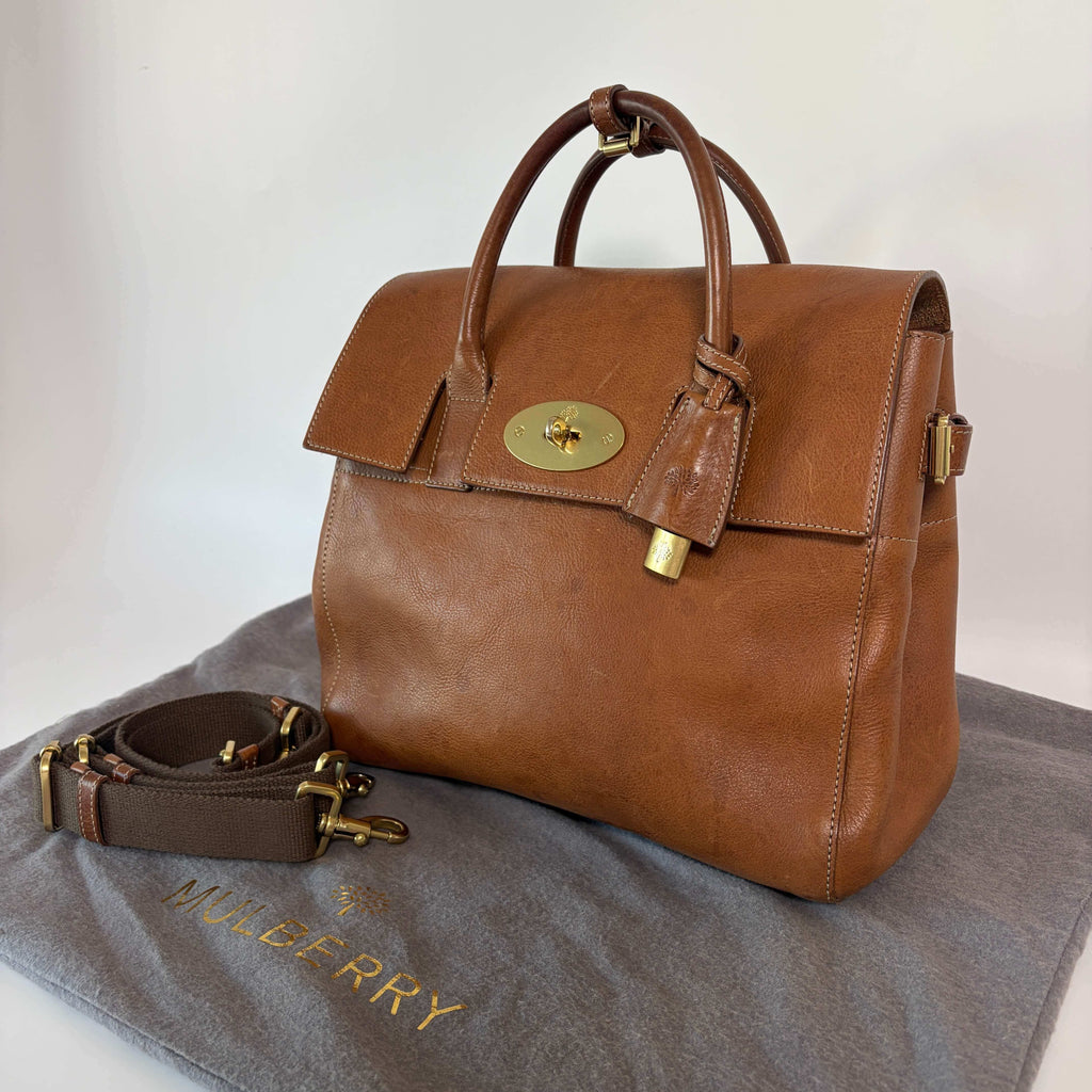 Authentic Mulberry Cara Delevingne Backpack Oak leather angled view with gold-tone turn-lock closure
