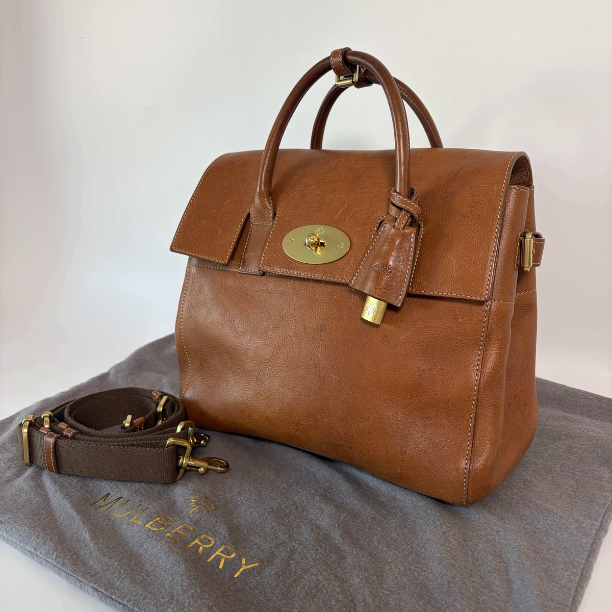 Authentic Mulberry Cara Delevingne Backpack Oak leather angled view with gold-tone turn-lock closure